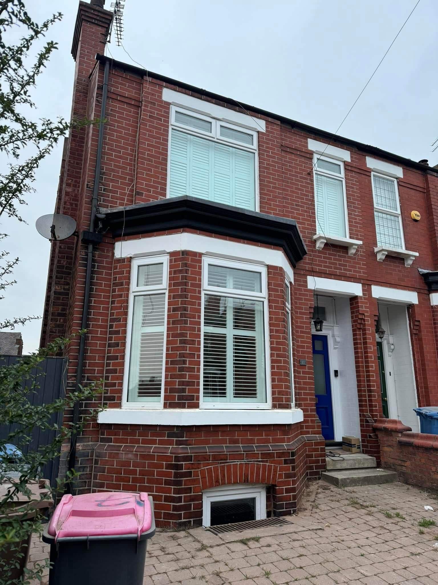 Victorian brick house with fresh mortar joints after repointing restoration work
