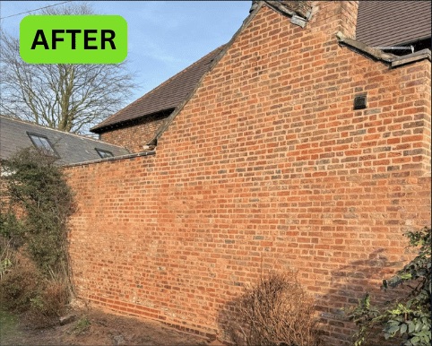 The same Manchester brick wall after repointing with clean mortar joints