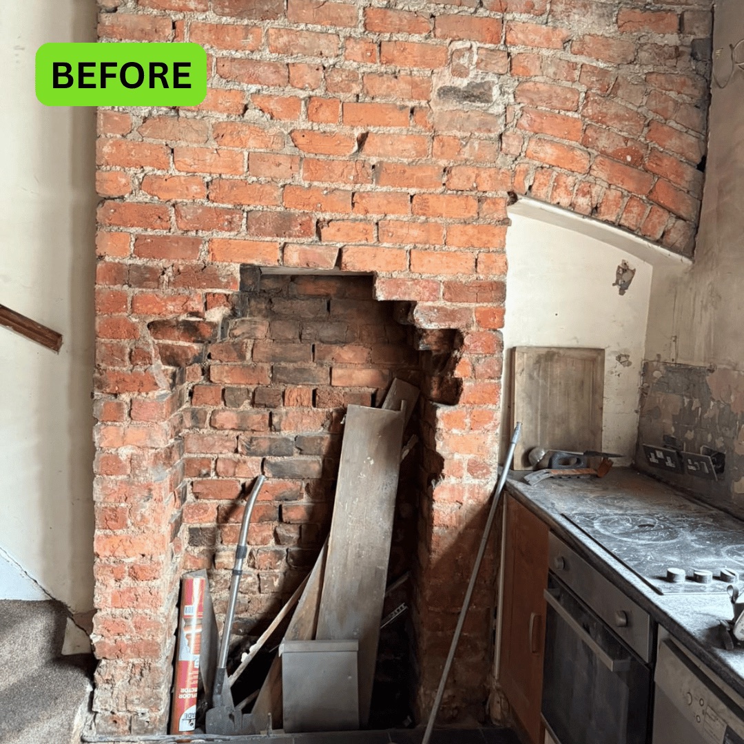 Exposed original brick fireplace before restoration at a property in Wigan